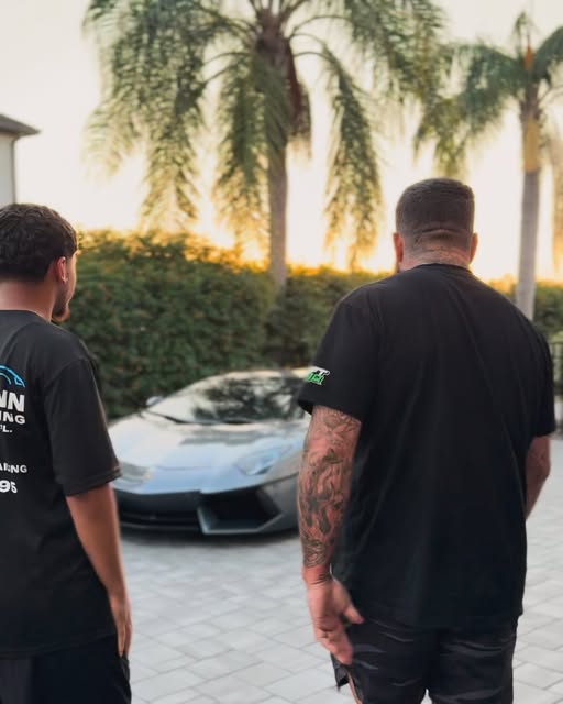 Precisionn Detailing team approaching a luxury vehicle