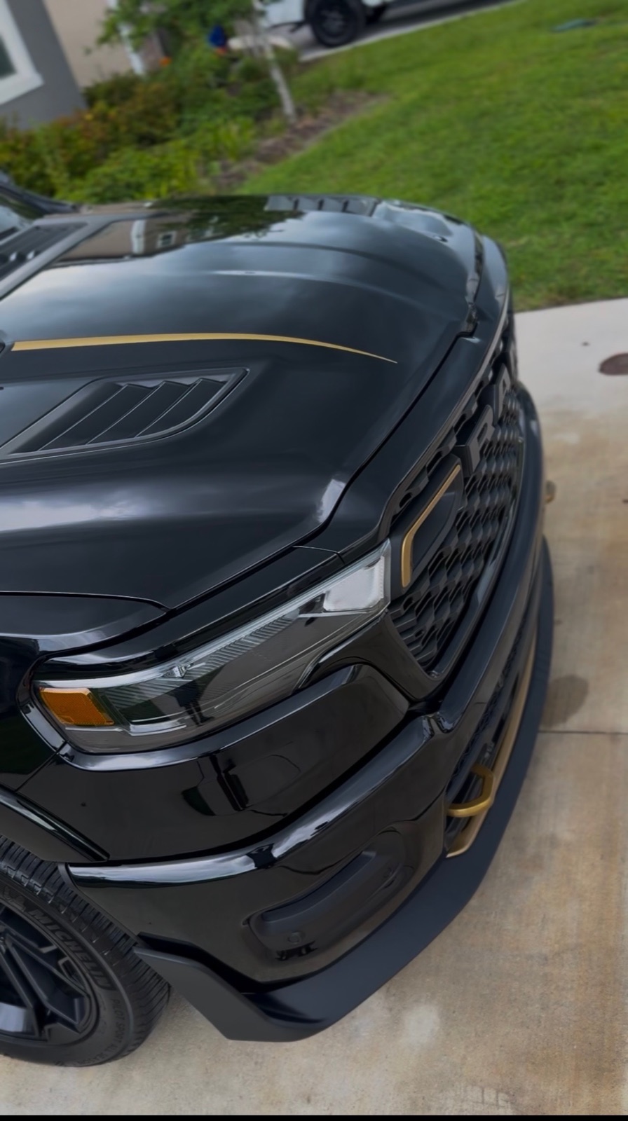 Glossy black vehicle finish after paint correction
